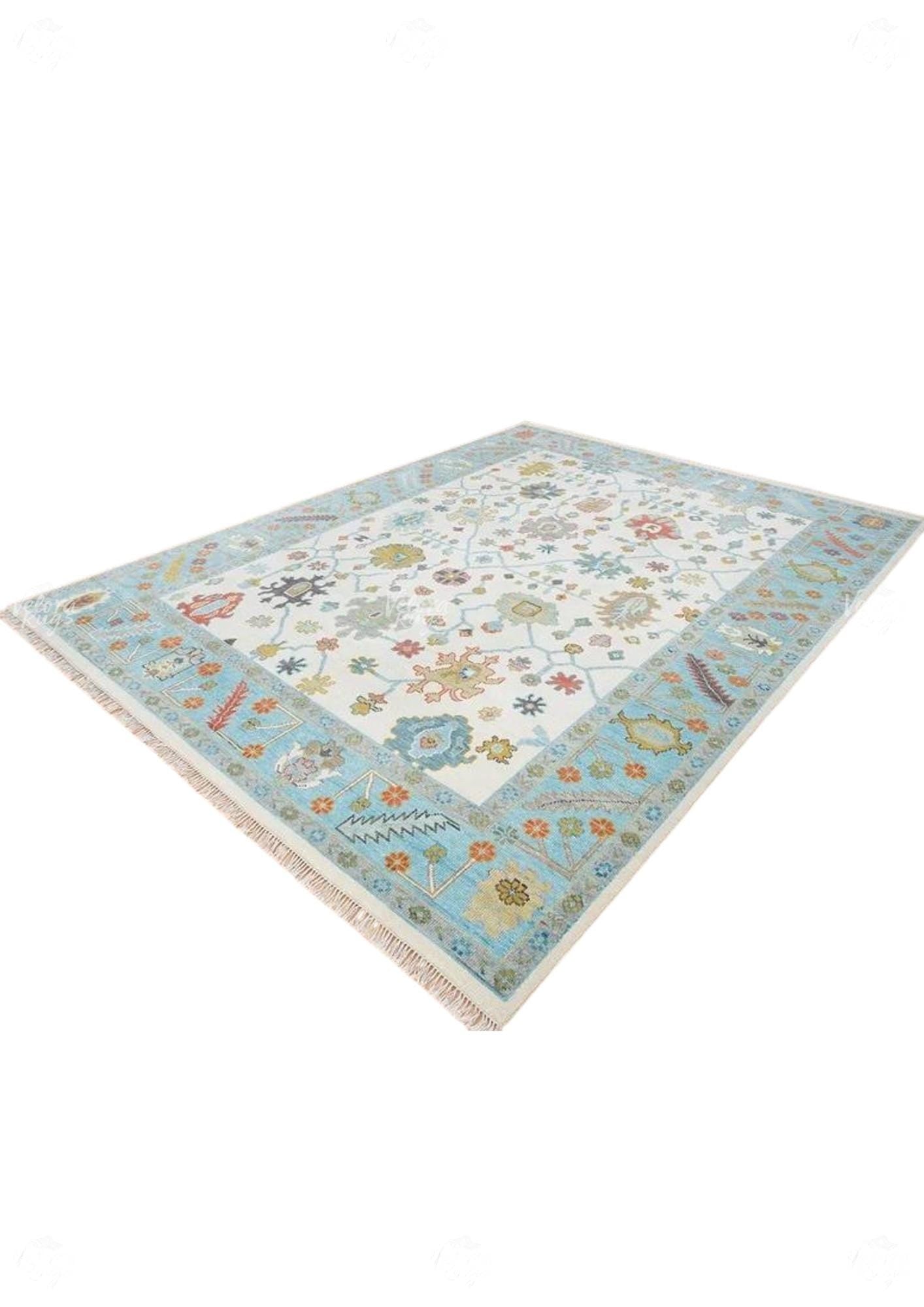 Hand-Knotted Oushak Wool Rug: Ivory, Sky Blue, and Rust Accent