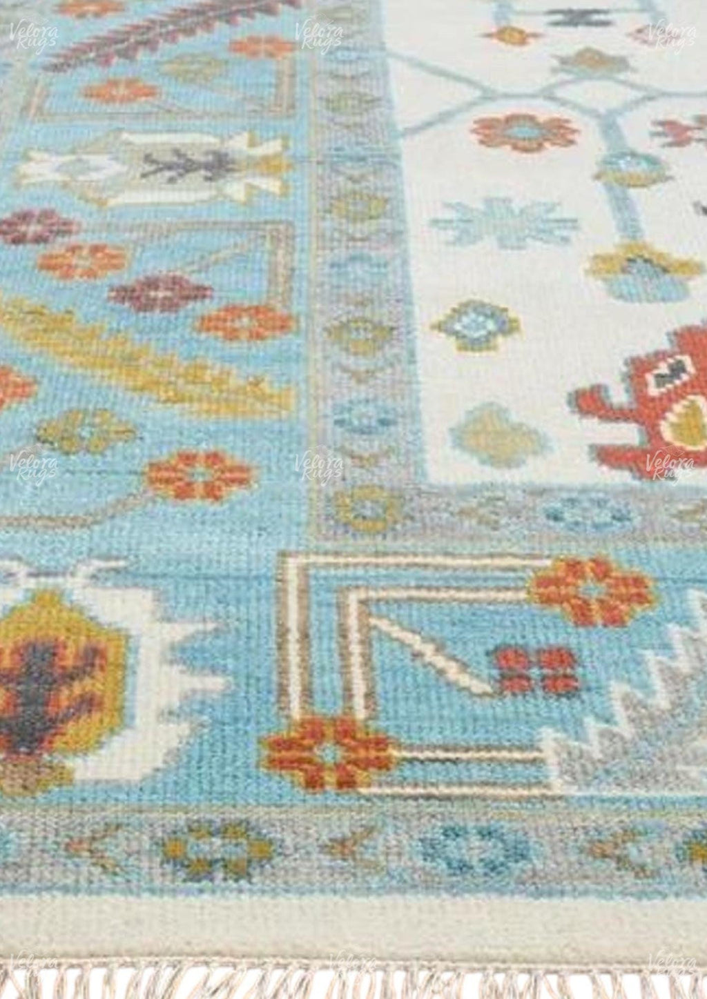 Hand-Knotted Oushak Wool Rug: Ivory, Sky Blue, and Rust Accent