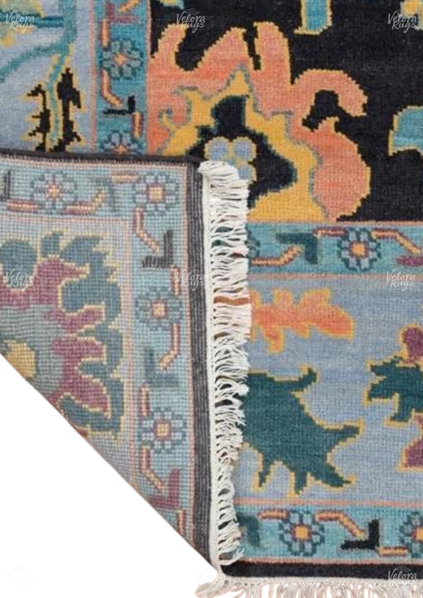 Hand-Knotted Black Oushak Wool Rug: Vintage Turkish Floral Carpet